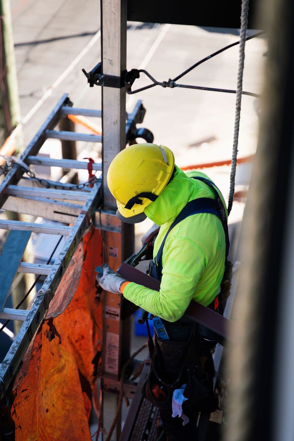 An architect sitting at a table drafting a building concept.